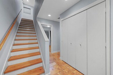 Stairway with light tile floors