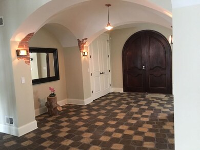 DOUBLE DOOR TO ENTRANCE FOYER.