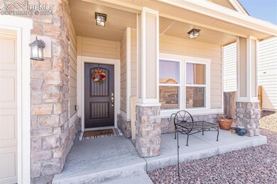 Covered entrance featuring covered porch