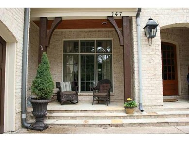 front covered porch with gas light and cedar post