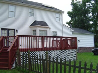 Rear yard, deck and fence.