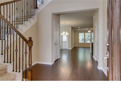 Foyer with hardwood / wood-style floors, stairs, 