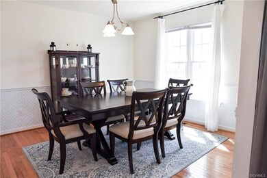 Spacious formal dining room with gleaming hardwood