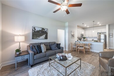 Living room with light hardwood / wood-style floor