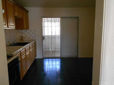 Kitchen that goes out to the enclosed patio, not p