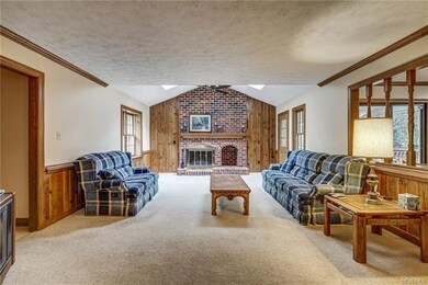 Family room features a brick fireplace with gas lo