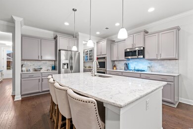 Kitchen with dark hardwood / wood-style floors, ba