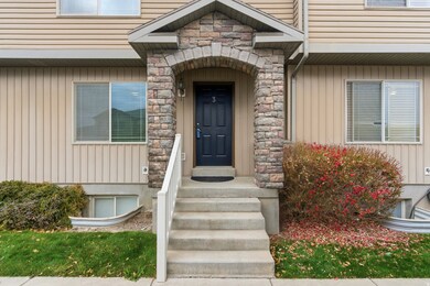 Property entrance featuring stone siding