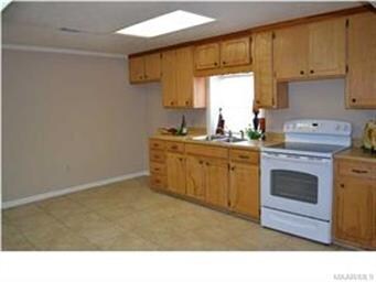 Lots of cabinets in this great kitchen.