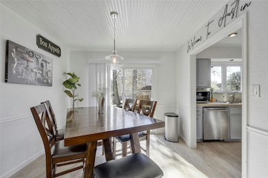 Dining area with light wood-type flooring