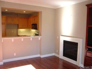 Living room shares counter bar with kitchen area