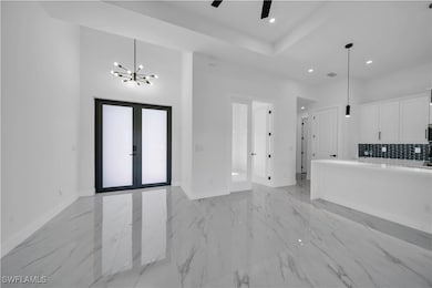 Unfurnished living room with marble finish floor,