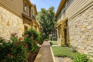 View of property exterior featuring stone siding 