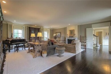 The spacious, Formal Living Room features gleaming