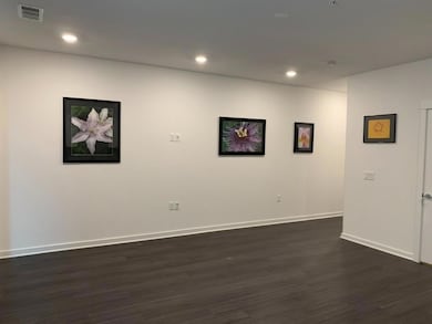 Empty room with baseboards, dark wood-type floori