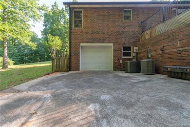 3rd garage bay in basement with additional work areas/ bar area.