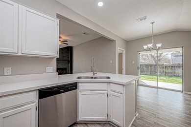 A double basin under-mount sink adds a seamless, m