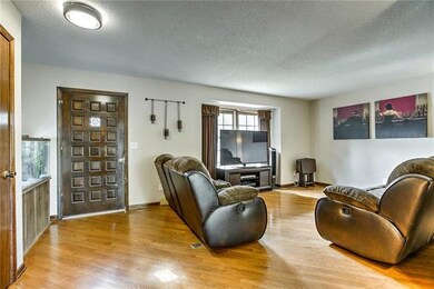Spacious great room with wood floors.