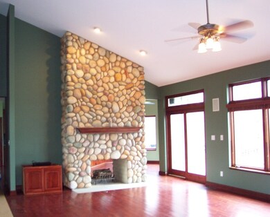 Living room with see through masonry fireplace