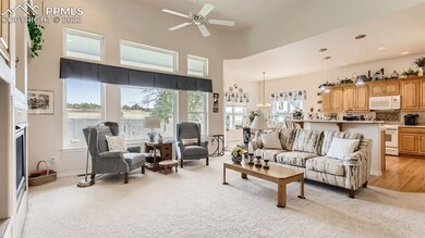 Living room with lots of windows and adjacent to k