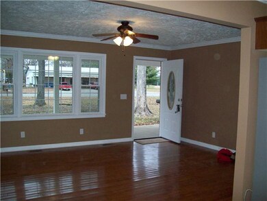Large open family room with hardwood floors. 