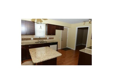 Kitchen with a window over the sink and access to 