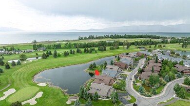 Aerial overview of property's location with a water and mountain view