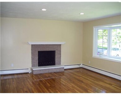 Living Room. 18x15 LR offers a brick FP,  Re-finis