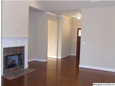 Large family room has a soaring, vaulted ceiling.