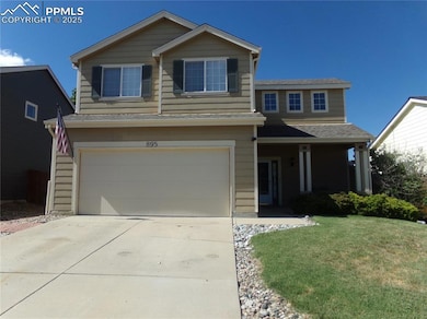 View of front of home featuring an attached garage, a front lawn, concrete driveway, and roof with shingles