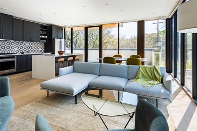 Living room featuring a wall of windows and light