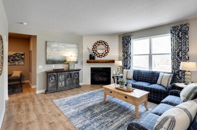 Beautiful living room space; great for entertaining.  *Photo is of a model home.  Finishes in actual home may differ.