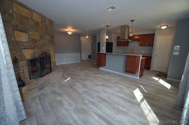 Spacious living room with enhanced vinyl plank flo