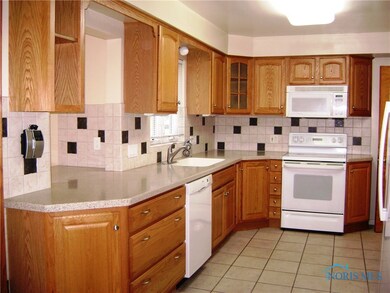 Remodeled kitchen with corian countertops, ceramic