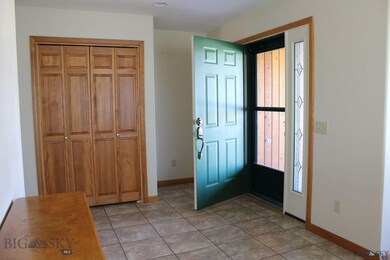 Large entry hall with tile floor and coat closet