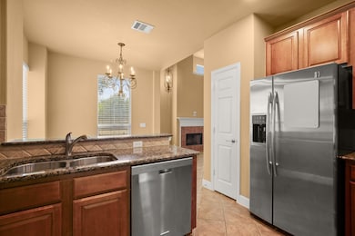 Kitchen with appliances with stainless steel fini