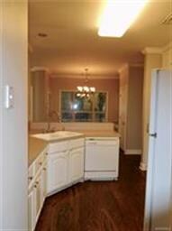 Kitchen with wood floors and plenty of cabinet and