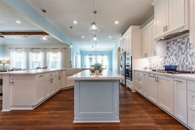 Stunning kitchen with hidden pull-out trash can ca