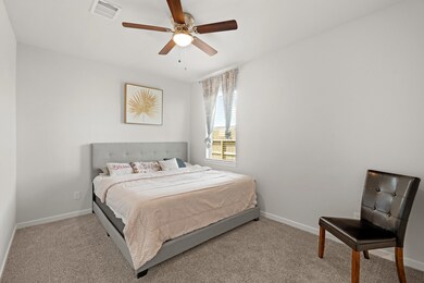Inviting downstairs guest bedroom with soaring cei