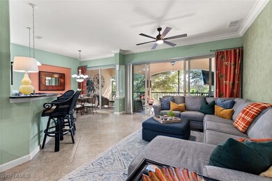 Tiled living room featuring visible vents, crown m