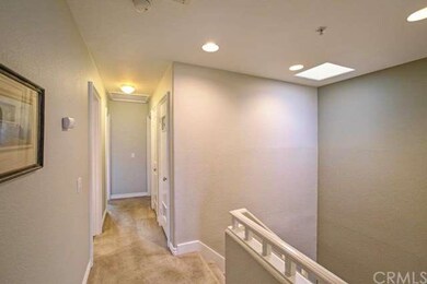 Upstairs landing with cathedral ceilings and skyli