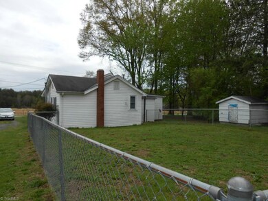 Back View of home with fenced backyard