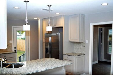 Granite countertops, LED recessed lighting, stone 