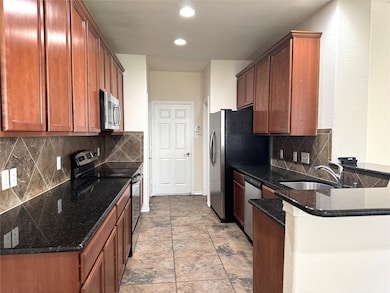 Kitchen with granite countertops and brand new sto