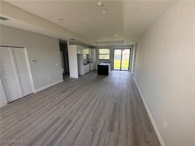 Unfurnished living room with wood finished floors