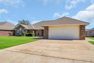 Ranch-style house featuring a garage and a front l