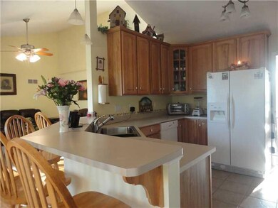 Kitchen. An open floor plan connects main living a