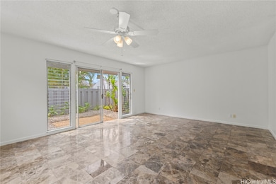 The living room leads into an open concept yard ar