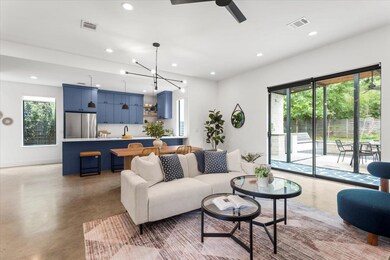 Living area featuring recessed lighting, concrete