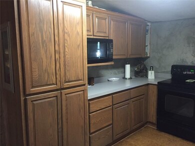 This home comes with all the appliances. Washer, dryer, dishwasher, refrigerator, range and microwave. This is the kitchen in the main house.